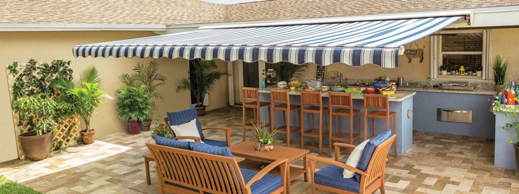 striped awning for outdoor patio & kitchen area